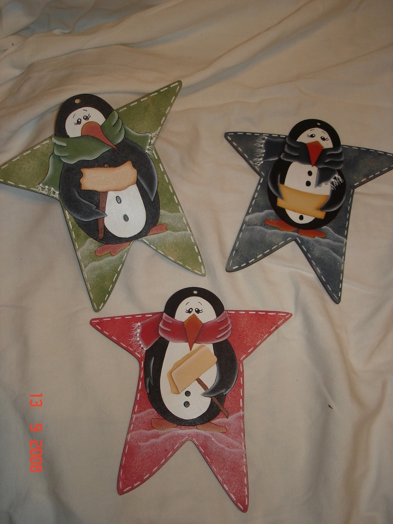 L23-022 Estrella con pinguino2 para guindar (rotulo mano derecha)